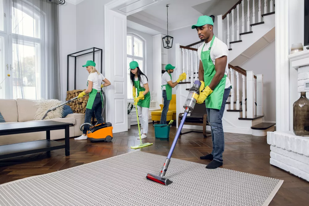 Man Vacuuming the floor